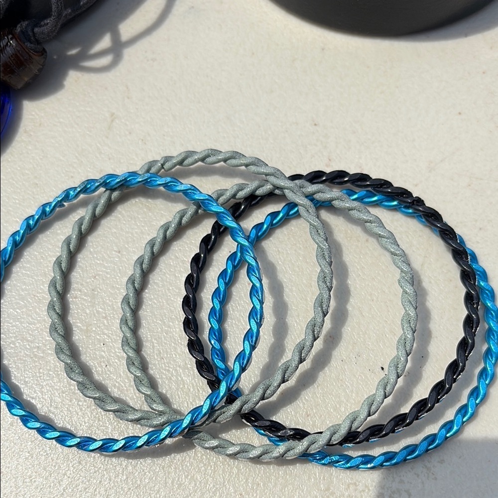4/$20 Set of Twisted Bangles in Blue, Gray, and Black